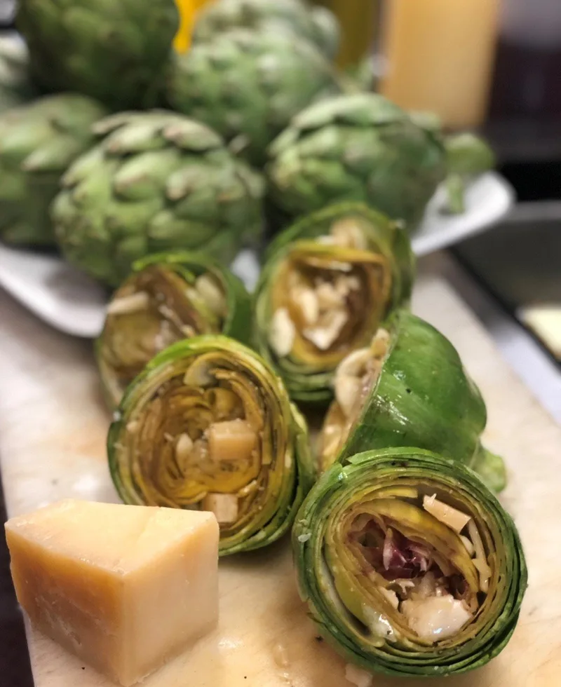 Grilled long stem artichokes with a wedge of parmigiano